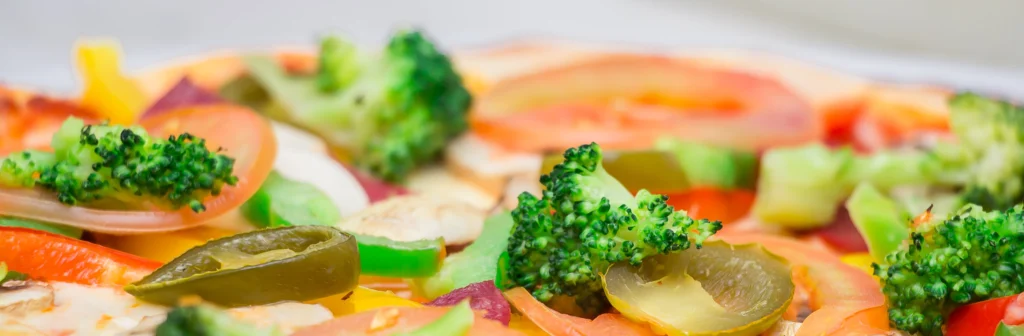 a pizza with vegetable toppings